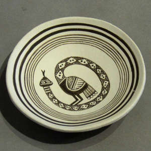 Black on white design on a miniature plate