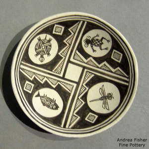 Mimbres animal and geometric design on a black and white plate