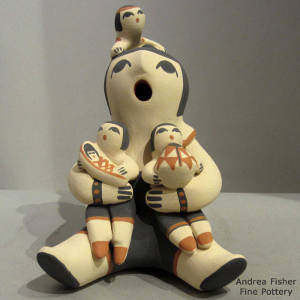 Three children on a grandmother storyteller