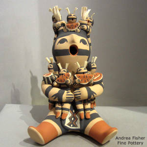 Seven children on a Koshare storyteller