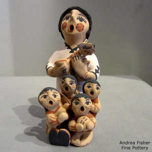 4 children and a puppy on a grandmother storyteller