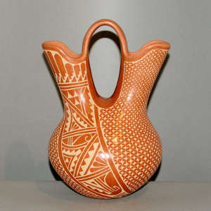Sgraffito geometric design on a red wedding vase