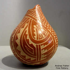 Sgraffito kiva step, snowflake and geometric design on a red jar with an organic opening