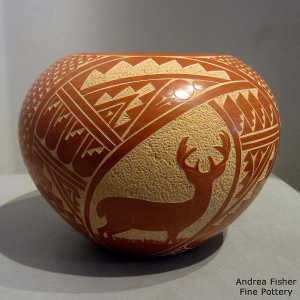 Sgraffito deer and geometric design on a red jar