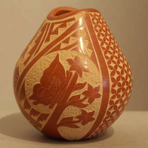 Sgraffito butterfly and geometric design on a red jar with an organic opening