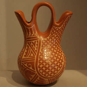 Sgraffito geometric design on a polished red wedding vase