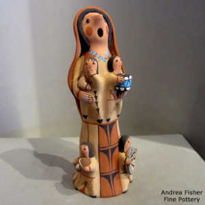 4 children on a Singing Mother figure