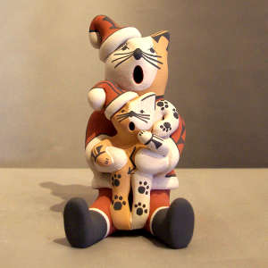 1 kitten on a feline Santa storyteller