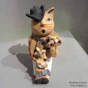 3 kittens on a cowboy cat storyteller
