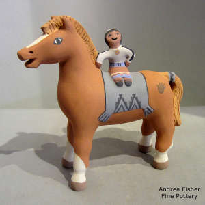 Child riding a horse