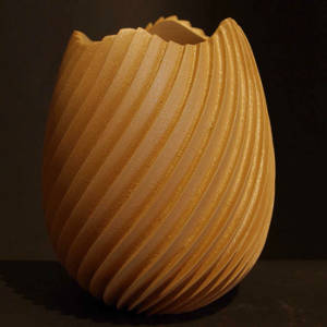 An irregular opening marks this orange micaceous swirl-carved jar