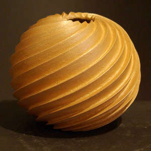 Spiral-cut jar in golden micaceous clay