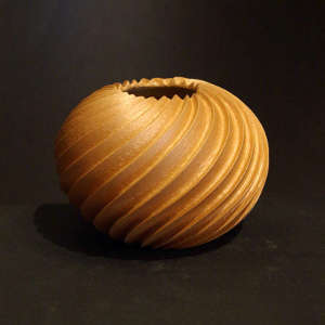 Deep carved golden micaceous swirl melon jar