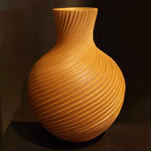 Carved micaceous clay swirl jar