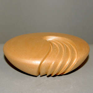 Four cut ribs on a golden micaceous seed pot