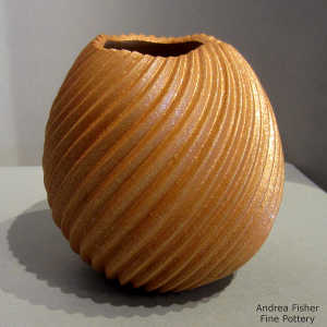 Organic opening on a golden micaceous spiral-cut jar