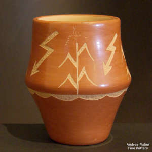 Sgraffito corn stalk and lightning design on a polished red jar