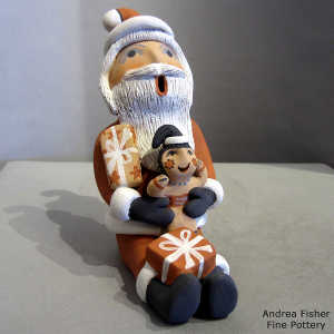 1 child and 2 gifts on a Santa Claus storyteller