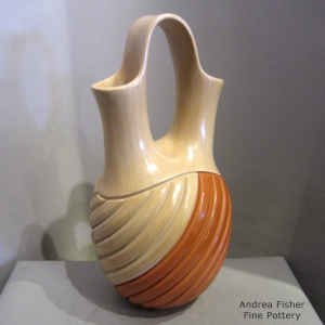 Melon design carved into a red and tan wedding vase