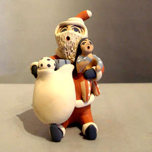 1 child and a bag of gifts on a Santa storyteller