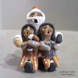 2 children on a Santa Claus storyteller