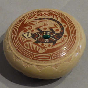 Sgraffito and painted lizard and geometric designs on a polychrome seed pot