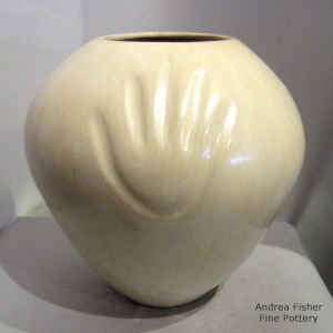 Bear paw imprints on a tan jar