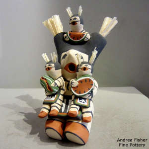 Three children with a Koshare storyteller