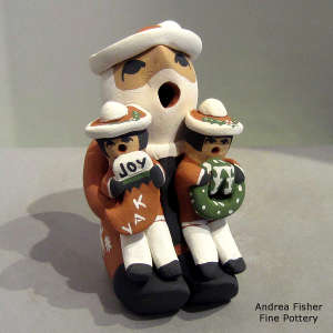 2 children on a Santa Claus storyteller