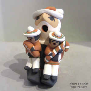 Two children on a Santa Claus storyteller