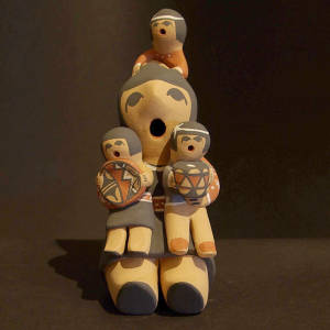 Three children on a female storyteller