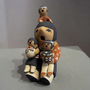 Three children with a grandmother storyteller