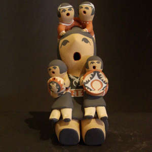 4 children on a grandmother storyteller