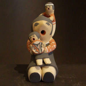 Two children and a basket on a grandmother storyteller