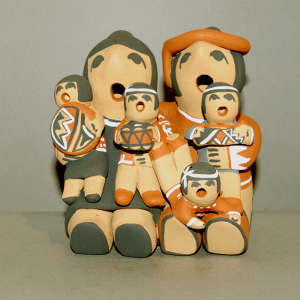 Four children on a grandfather and grandmother storyteller