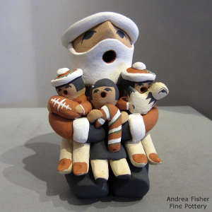 3 children on a Santa Claus storyteller