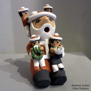 4 children on a Santa Claus storyteller