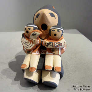 2 children on a grandmother storyteller