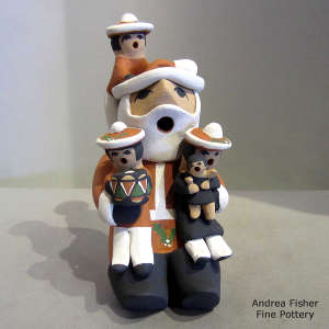 4 children on a Santa Claus storyteller