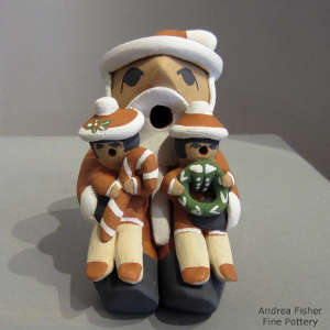 Two children on a Santa Claus storyteller