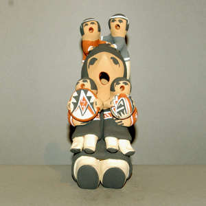 4 children on a grandmother storyteller