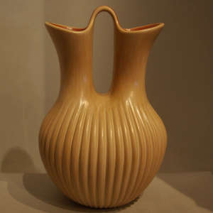 Carved base on a polished wedding vase