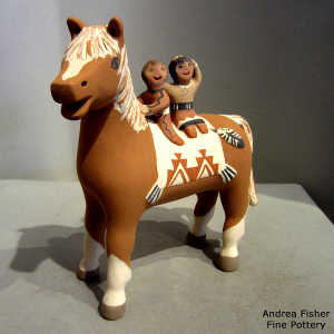 Two children riding a horse figure