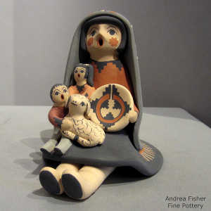 2 children, a lamb and a welcome basket on a grandmother storyteller