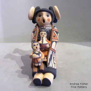 2 children on a grandmother storyteller