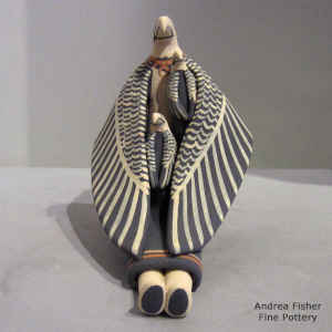 2 chicks on a sitting eagle storyteller