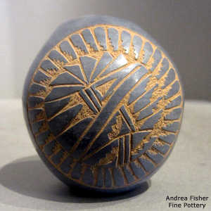 Sgraffito feather and geometric design on a grey seed pot