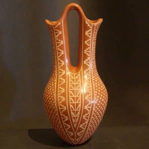 Sgraffito geometric design on a red wedding vase