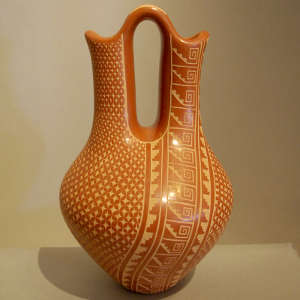 Sgraffito geometric design on a red wedding vase
