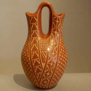 Sgraffito geometric design on a red wedding vase